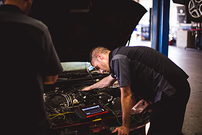 Factory Scheduled Maintenance | Custom Automotive Care